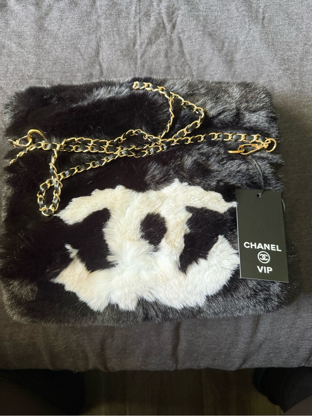 Luxury Black Faux Fur Shoulder Bag that doubles as a hand warmer